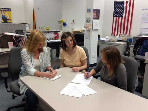 Judy Lynch, Dorleen Donahue, and Ellen Griffiths compose scripts for the videos. Photo: Marge McCabe.